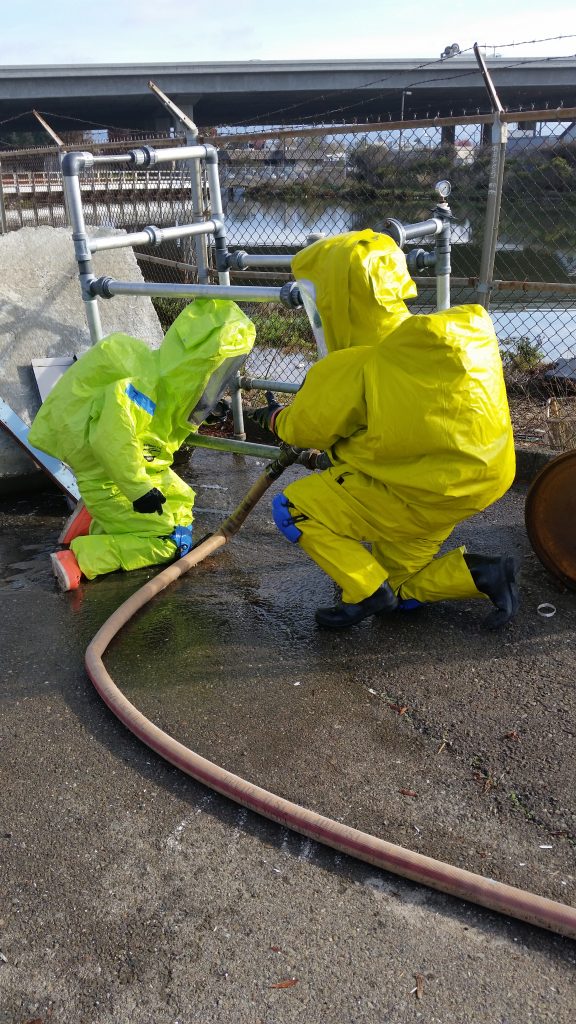 two first responders in level A hazmat attire